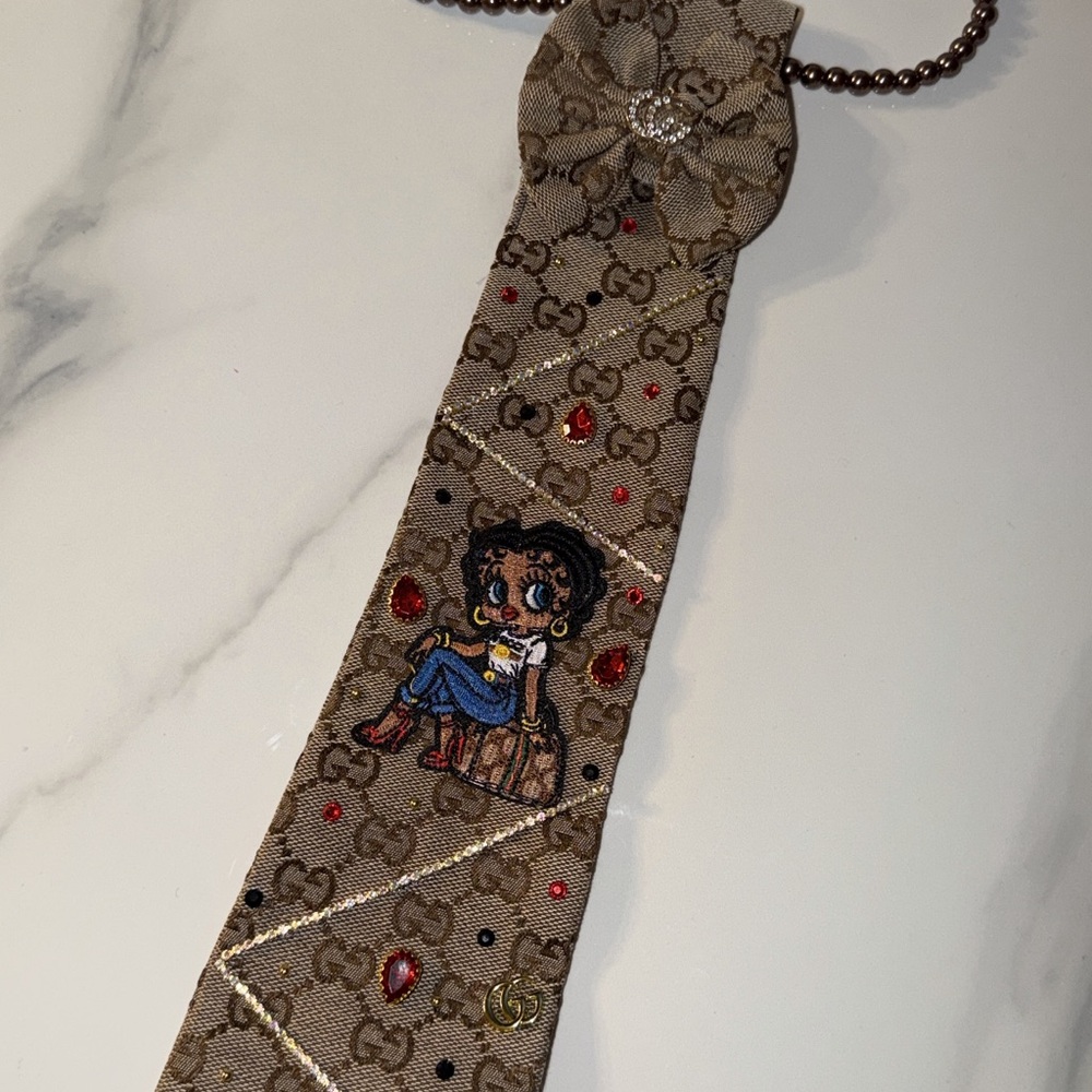 Gucci Beige Tie with Cartoon and Red Accents